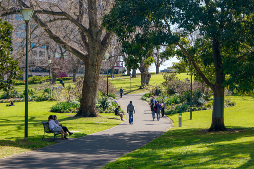 Melbourne, Australia - September 21st 2018: Public life in Flagstaff Gardens. Located in Melbourne's CBD, Flagstaff gardens is a popular park for people to meet up in, social sports, and for nearby workers to pass through.