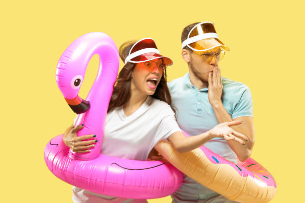 istock Beautiful couple isolated on yellow studio background 1149749019