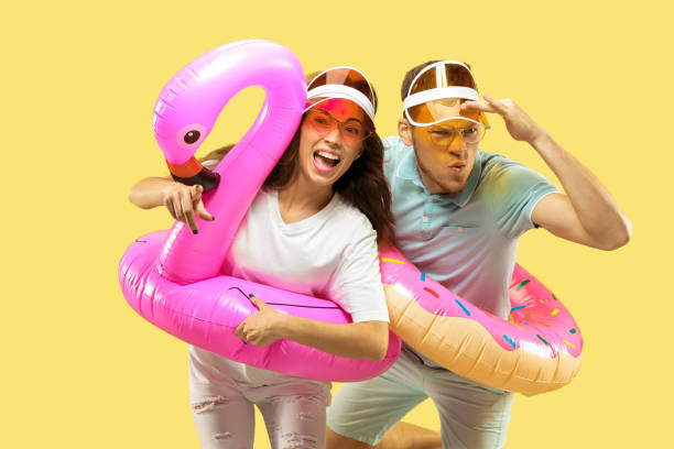 istock Beautiful couple isolated on yellow studio background 1149749020