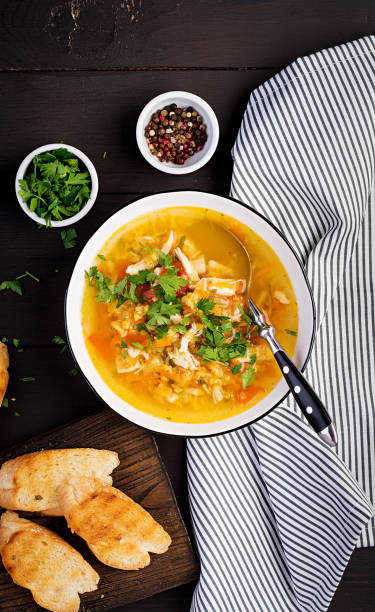 red lentil soup with chicken meat and vegetables close-up on the table. healthy food. top view - cooked vertical high angle view lentil imagens e fotografias de stock