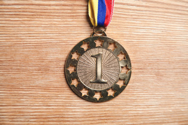 istock Medal awards for winner on wood background. 1149752494