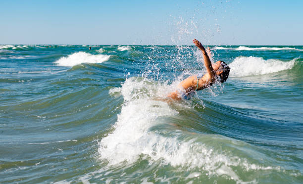 istock Girl in the waves. 1149754118