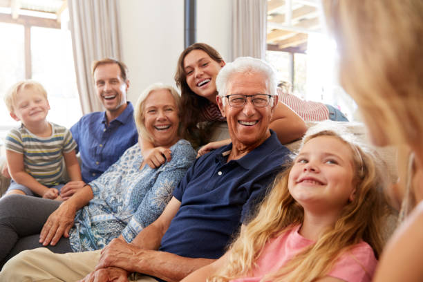 istock Multi-Generation Family Sitting On Sofa At Home Relaxing And Chatting 1149757955