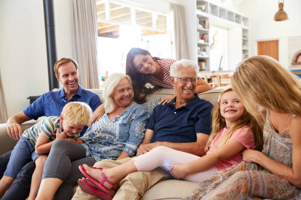 istock Multi-Generation Family Sitting On Sofa At Home Relaxing And Chatting 1149758315