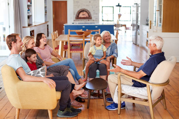 istock Multi-Generation Family Sitting On Sofa At Home Relaxing And Chatting 1149758353