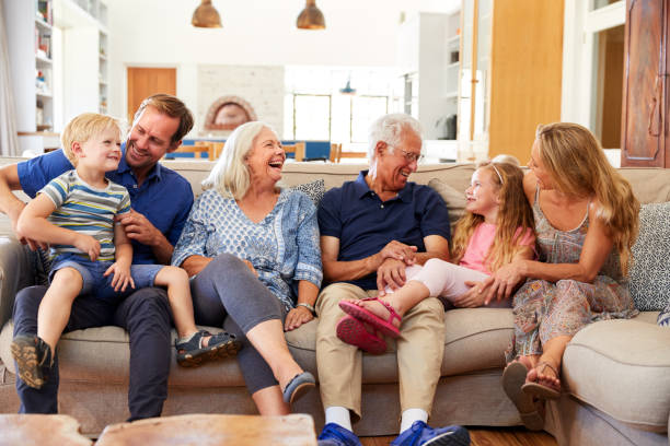 istock Multi-Generation Family Sitting On Sofa At Home Relaxing And Chatting 1149759034