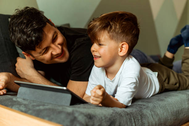 istock Father and Son playing game on digital tablet 1149759138