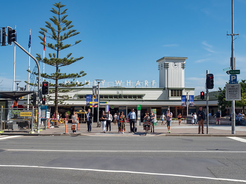 Sydney NSW Australia March 28th 2019 - Manly Wharf Facade and Pedestrians waiting Green Light in a sunny autumn day