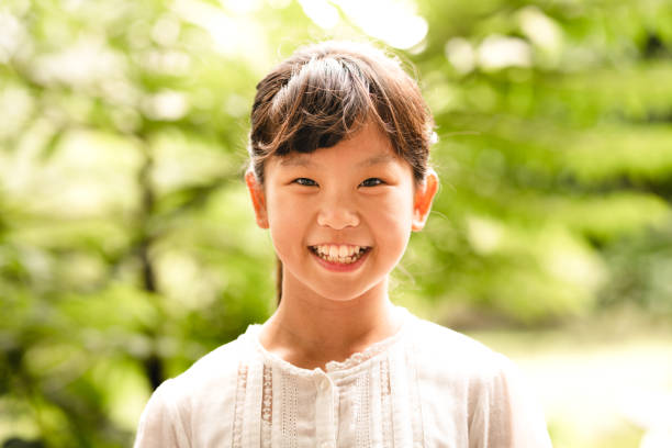 istock Happy young girl looking at the camera and laughing 1149760721