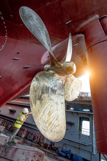 checking quality - crane shipyard construction pulley imagens e fotografias de stock