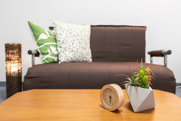 istock Alarm clock placed on the table in the living room 1149761407