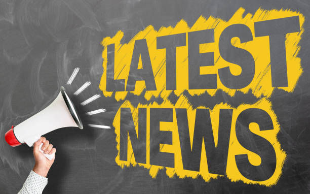 istock hand holding megaphone against chalkboard with text LATEST NEWS 1149765298