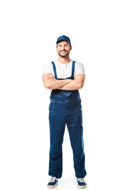 istock handsome mover in uniform with arms crossed looking at camera isolated on white 1149768950