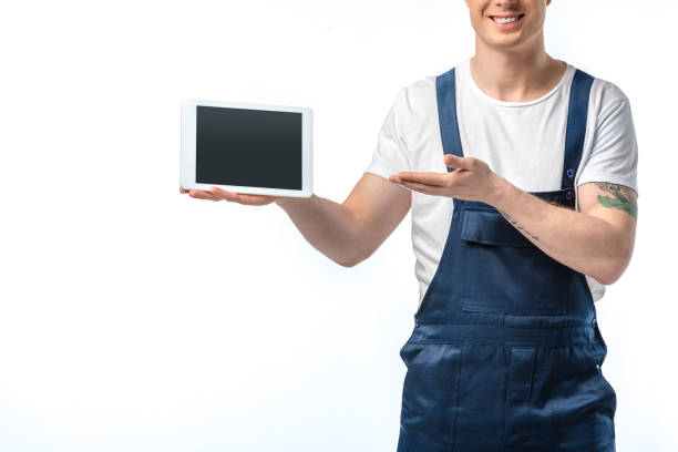 istock cropped view of smiling mover gesturing with hand and presenting digital tablet with blank screen isolated on white 1149769013