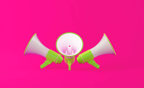 istock Green Megaphones on Pink Background 1149769881