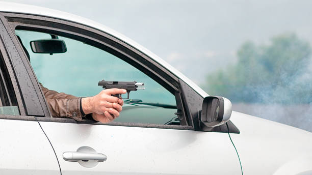 istock The car is explosive in front and is shooting a pistol. 1149771244
