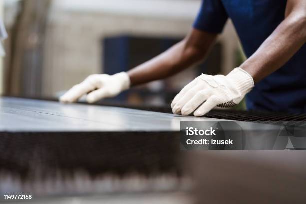 Apprentice Working On Puller Machine In Factory Stock Photo - Download Image Now - Sheet Metal, Manufacturing, Occupation
