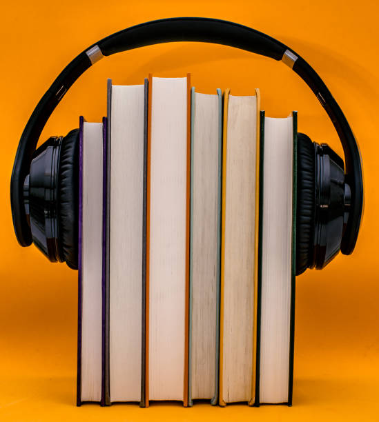 istock Audiobooks concept. Headphones put over book 1149772426
