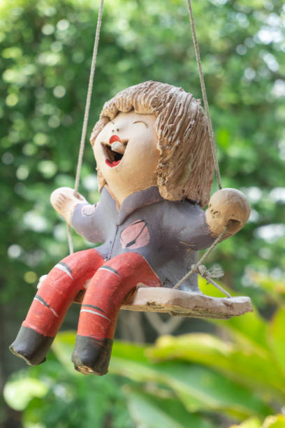 istock Doll sculpture on the garden 1149774020