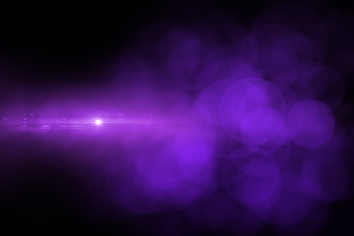 Lens Flare and Bokehs with Purple and Pink colors, Neon Lights on Black Background.