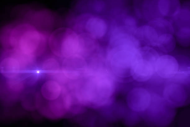 istock Lens Flare and Bokeh, Neon Colors Black Background 1149776690