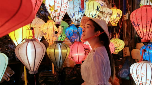 Travel asian woman choosing lanterns in Hoi An , Vietnam