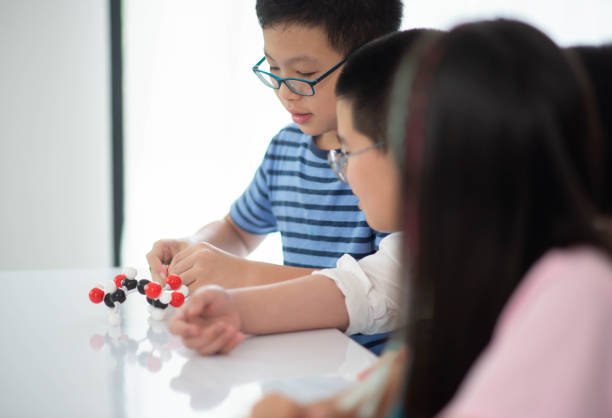 istock Group of Students study math with teacher in the classroom 1149783990