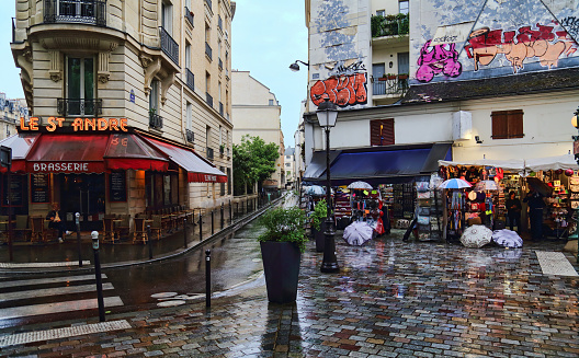 Street corner with bars and graffiti off Boulevard Saint-Michel in Paris, France on May 14, 2018