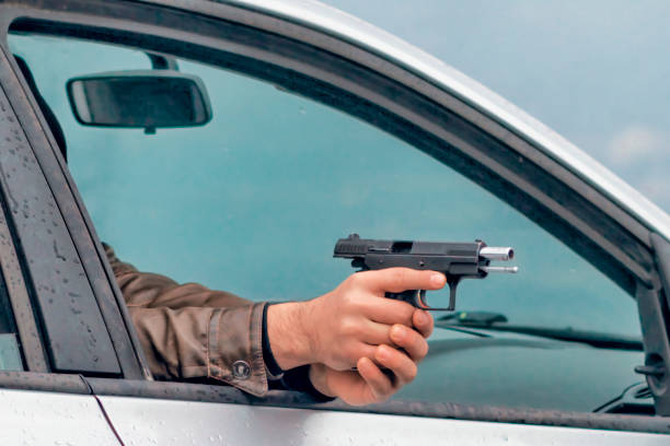 istock Hand shoots out of a car 1149795319