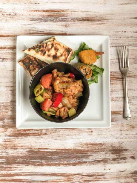 istock sweet and sour chicken and some side dish on table 1149795502