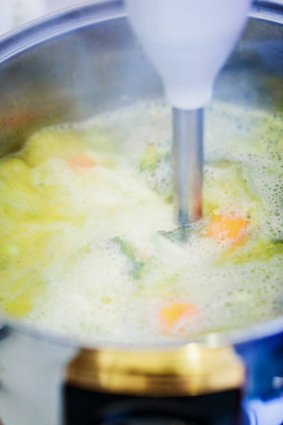 istock Broccoli soup preparing, stick mixer - blender, close-up 1149795931