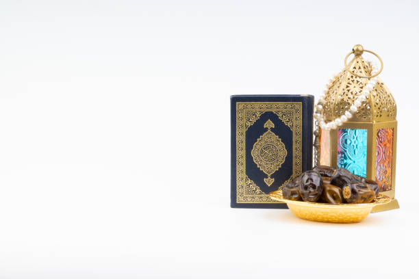 istock Lantern, Dates, Koran and Rosary on white background 1149798414