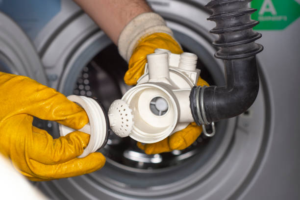 istock Coins in washing machine's drain pump filter 1149800752