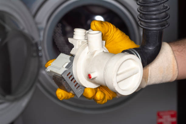 istock Coins in washing machine's drain pump filter 1149801475