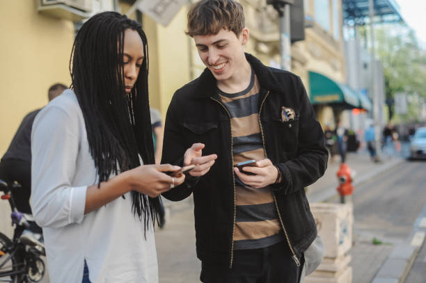 istock Mixed-race young couple using mobile phone 1149802999
