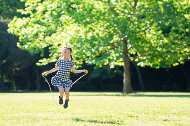 istock Girl playing with skipping rope 1149809227