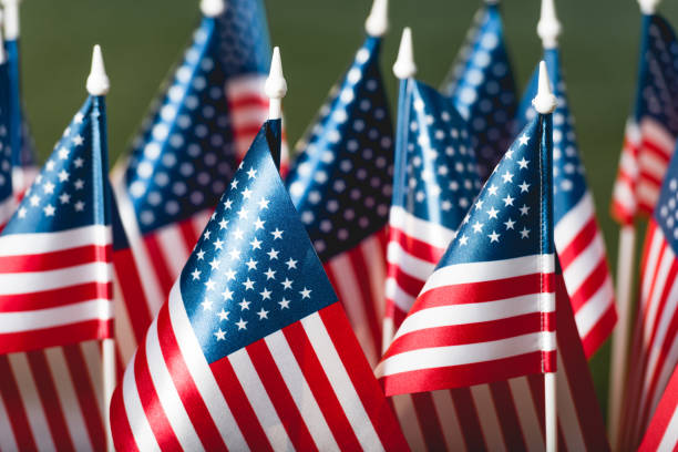 istock selective focus of stars and stripes on american flags 1149812284