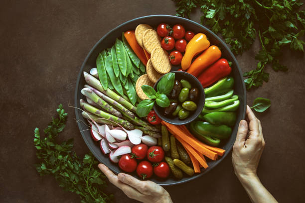 istock Crudites plate served by woman's hands 1149812718
