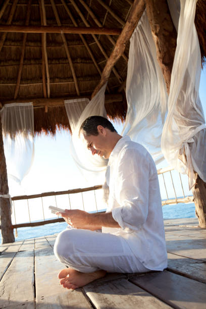istock man in a bungalow on the sea 1149813837