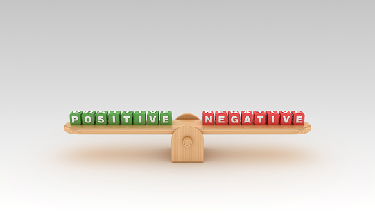 Seesaw with POSITIVE NEGATIVE Buzzword Cubes - Gradient Background - 3D Rendering