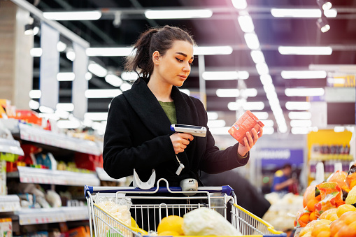 Cheerful young woman shopping in a shopping mall