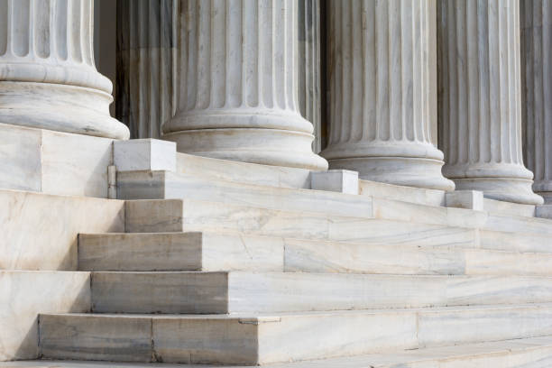 architectural detail of marble steps and ionic order columns - law column courthouse greek culture imagens e fotografias de stock