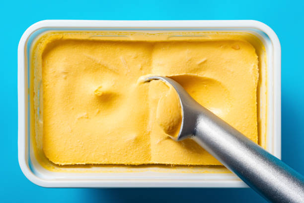 istock top view spoon taking out mango flavor ice cream 1149825851