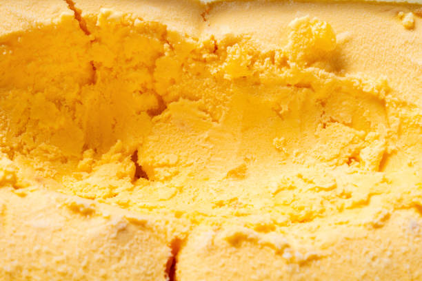 istock top view box of mango flavor ice cream with some digged out 1149826553