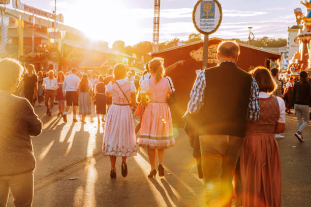 people at oktoberfest in munich, germany - carnival amusement park amusement park ride traditional festival imagens e fotografias de stock