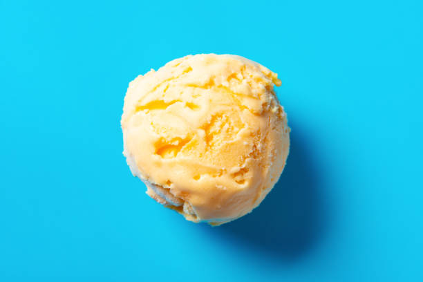 istock top view mango flavor ice cream ball on blue background 1149830691