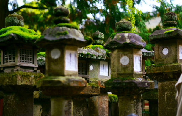 Nara, Japan - November 9, 2018 :Established more than 1300 years ago, Kasuga Taisha is the guardian shrine of Nara. It is the headquarters of Kasuga Shrines throughout Japan.. Famous for its many bronze lanterns and many stone lanterns that lead up the shrine.