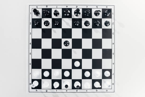 istock top view of black and white chessboard with figures on white background 1149832588