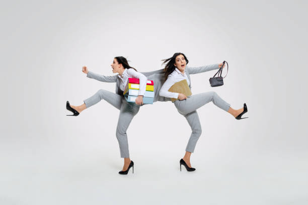 istock Young woman torning between cases 1149832914