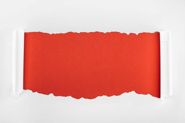 istock ripped white textured paper with curl edges on red background 1149835684